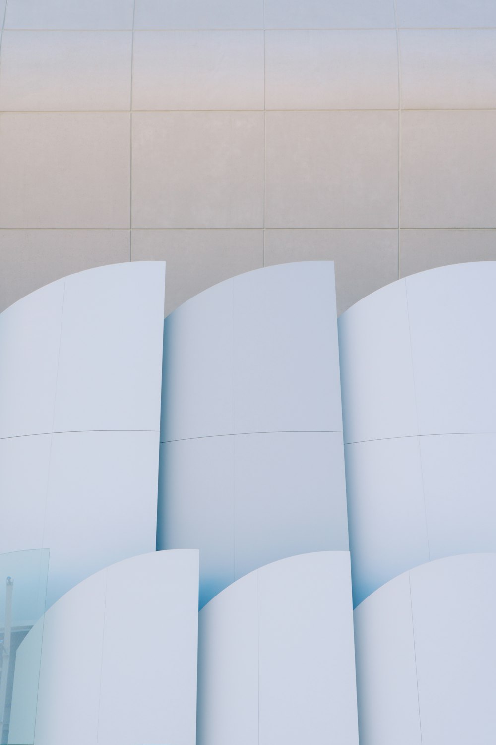 a white building with a clock on the side of it