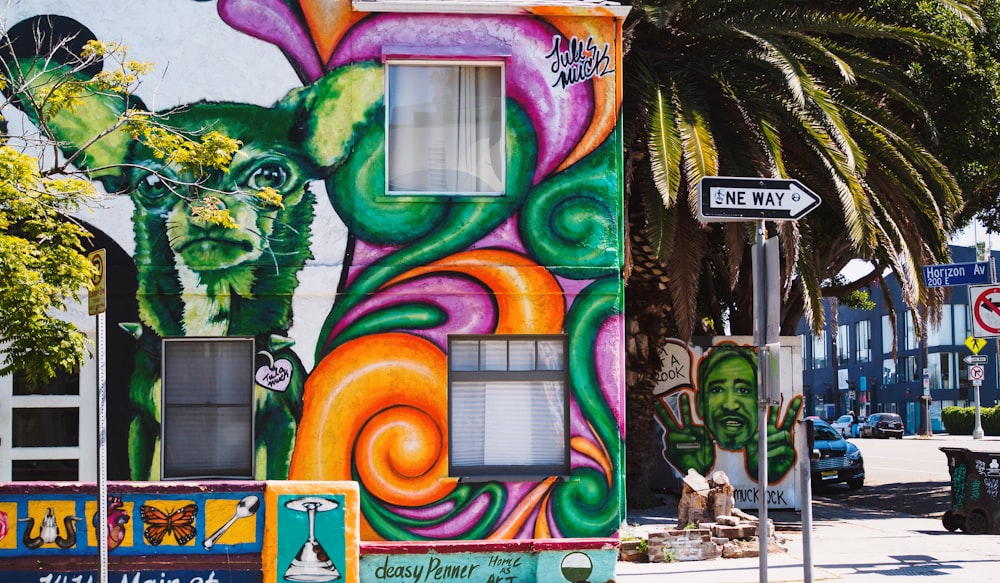 multicolored building mural during day