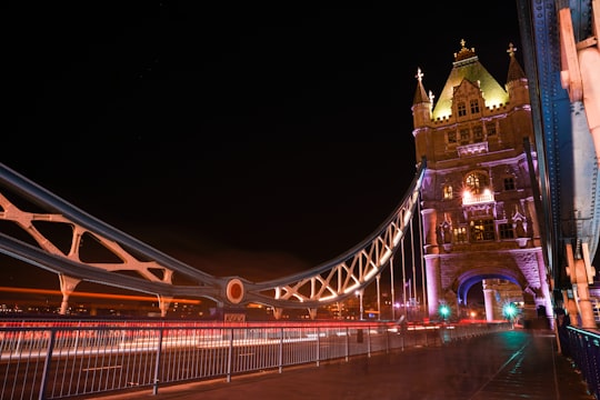 lighted bridge during nighttime in Tower Bridge United Kingdom