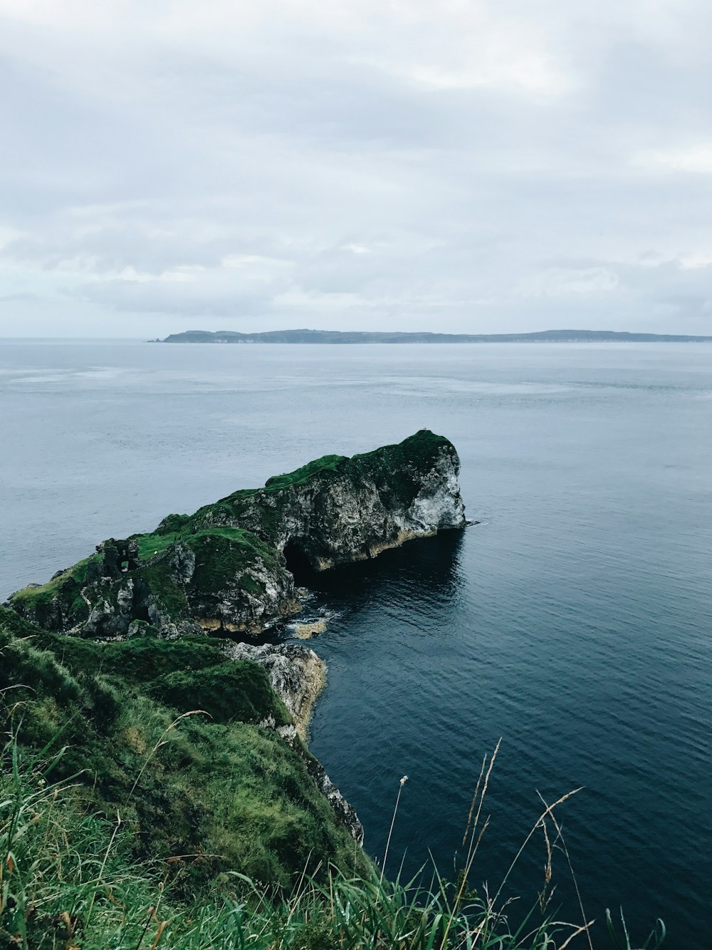 photo of cliff near sea