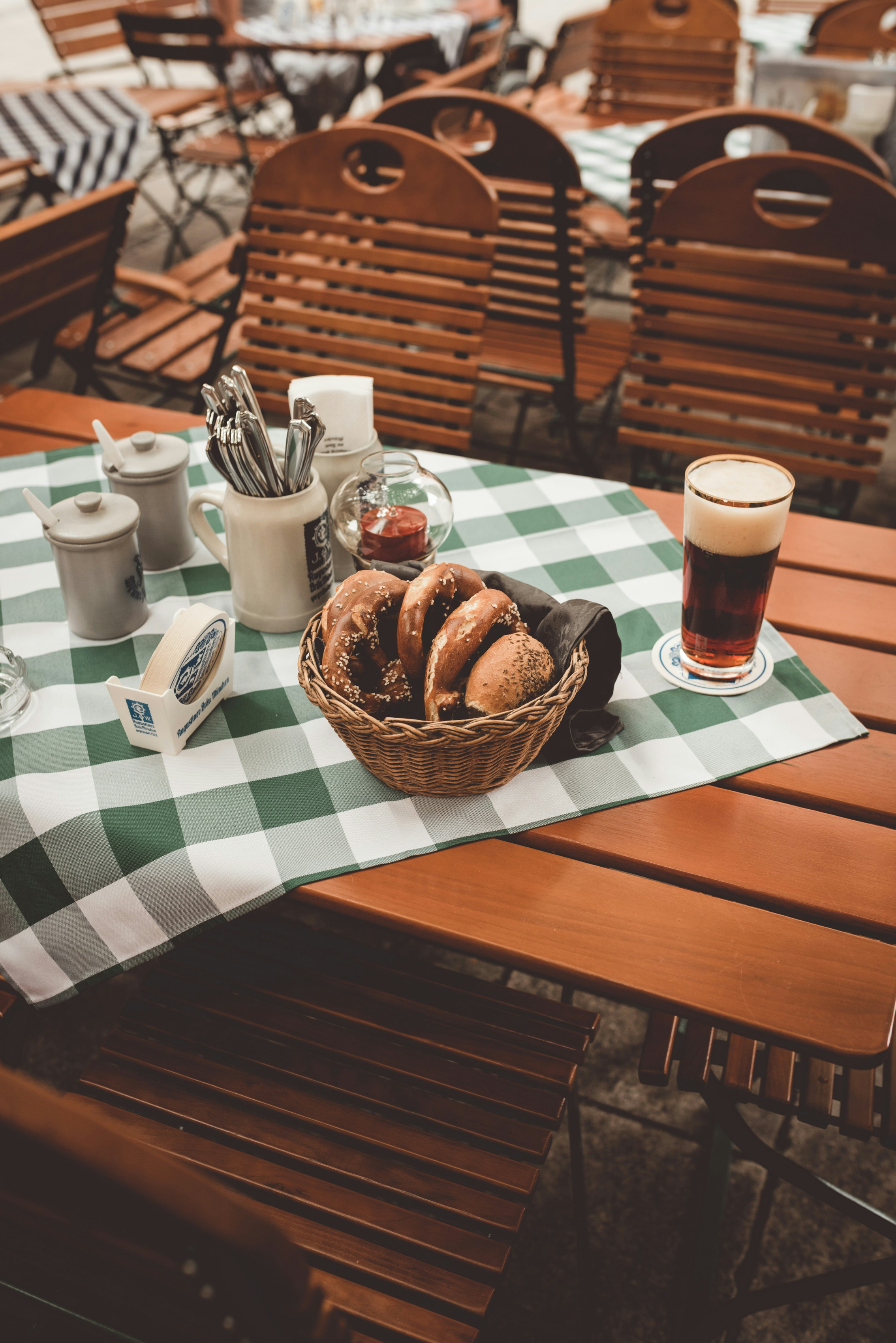 clear drinking glass beside doughnut