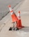 two traffic cones on gray road