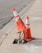 two traffic cones on gray road