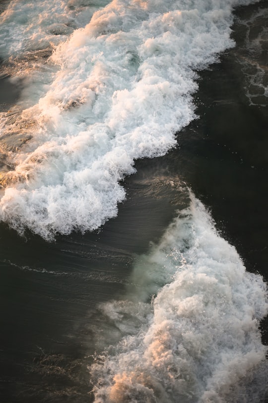 waves crashing on shore in aerial photography in Huntington Beach United States
