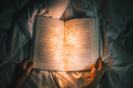 A calm nighttime scene with Andrea reading a bedtime story under warm, soft lighting.