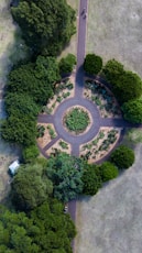 aerial photograph of a circular garden surrounded by trees