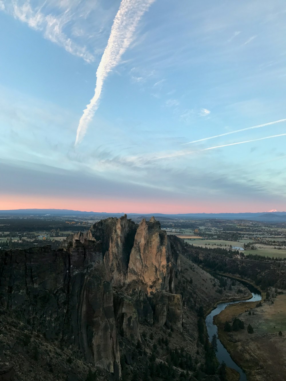 aerial photography of rock formation surrounded with body of water