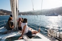 people sitting on front of yacht
