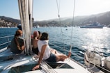 people sitting on front of yacht