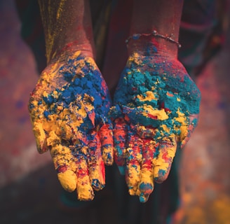 closeup photo of person holding color soils