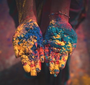 closeup photo of person holding color soils