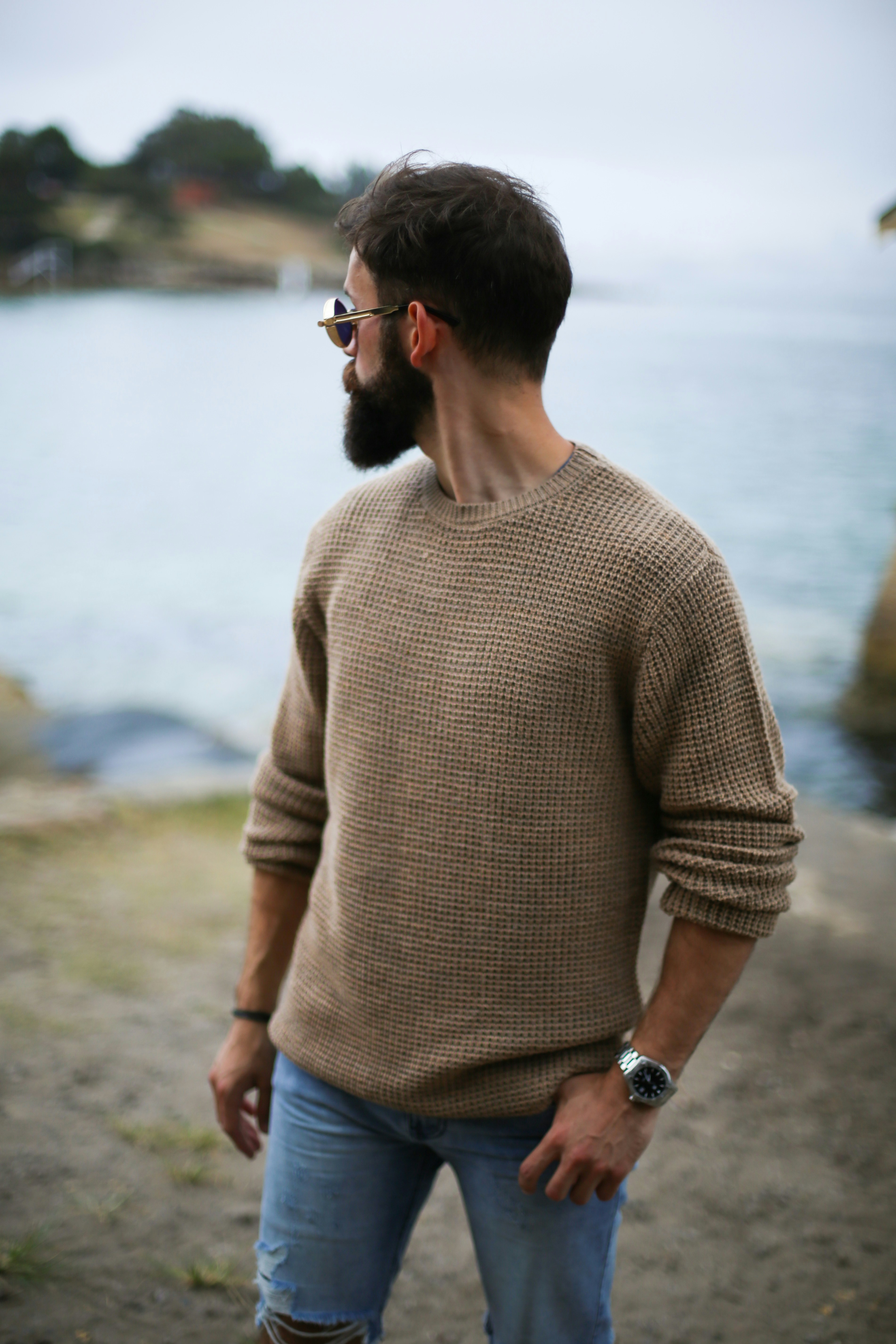 Knit sweater in sand color full view, showing waffle knit pattern, relaxed fit, and crew neckline (Photograph by Jonathan Zerger)
