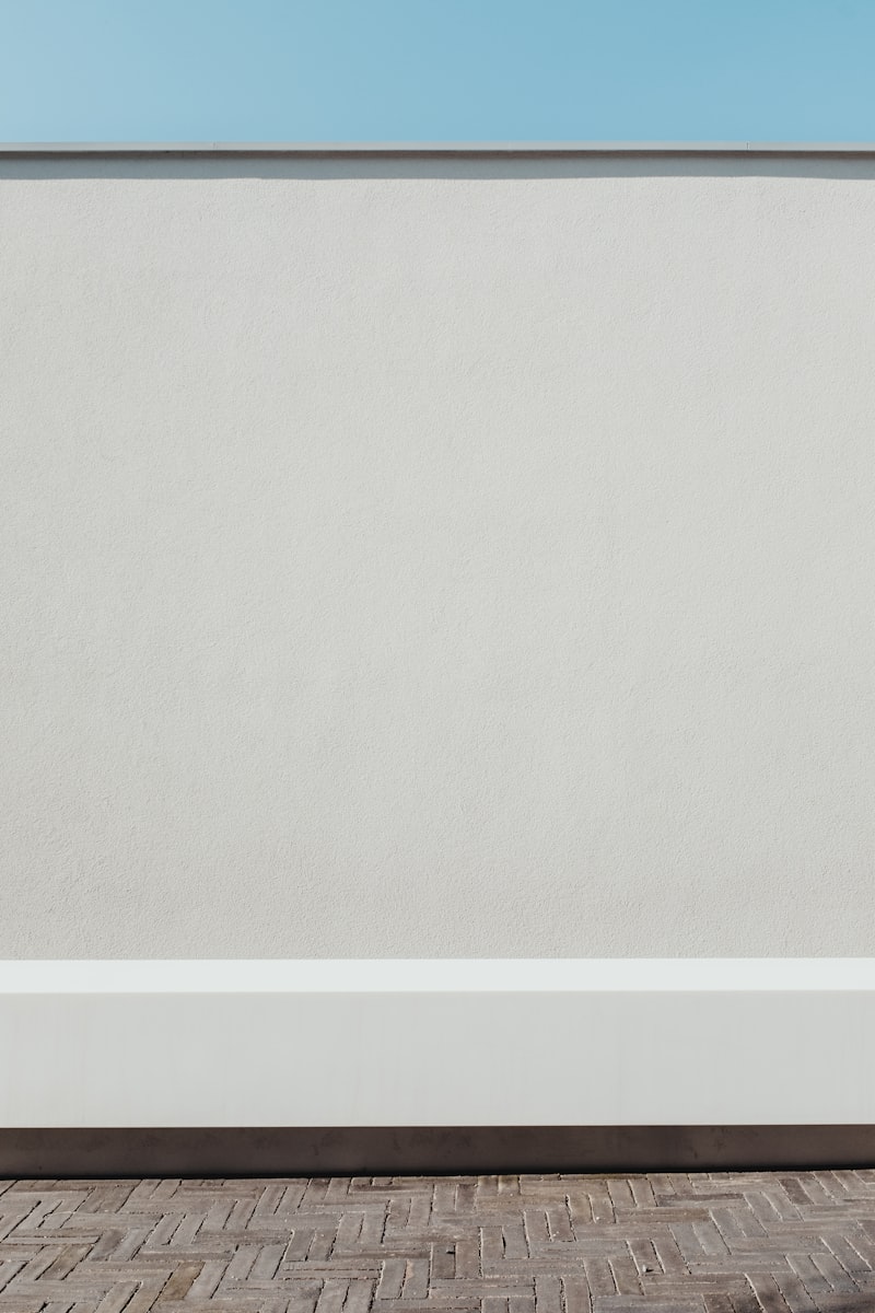 Bright gallery interior with white walls and carefully hung framed prints