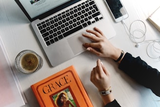 person typing on MacBook Pro keys