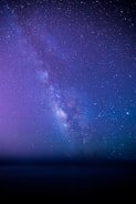 A stunning display of nail art inspired by the night sky.