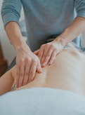 man massaging woman's body