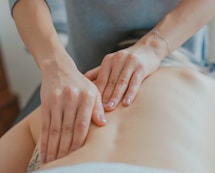 man massaging woman's body