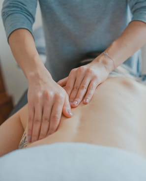 man massaging woman's body