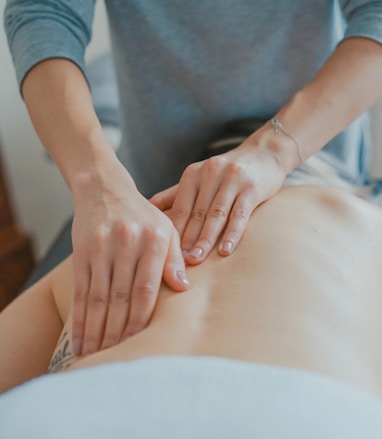 man massaging woman's body