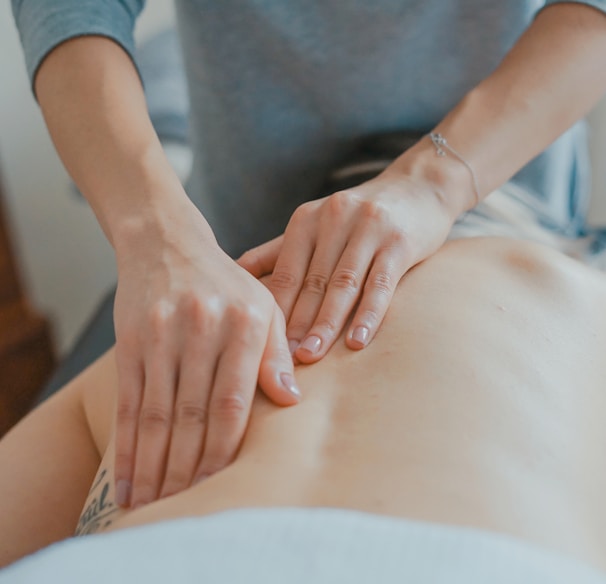 man massaging woman's body