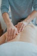 Therapist performing a relaxing Swedish massage for stress relief.