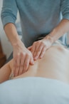 man massaging woman's body