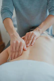 man massaging woman's body