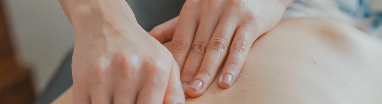 man massaging woman's body