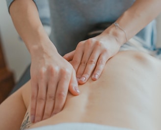 man massaging woman's body