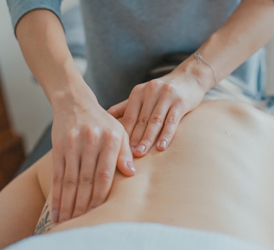 man massaging woman's body