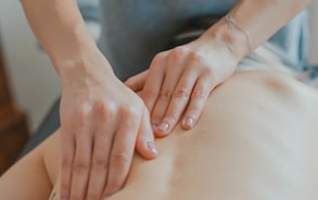 man massaging woman's body