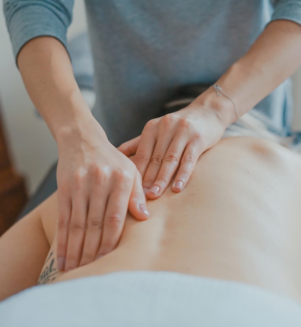 man massaging woman's body