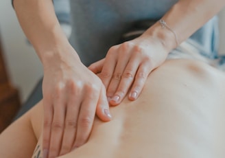 man massaging woman's body