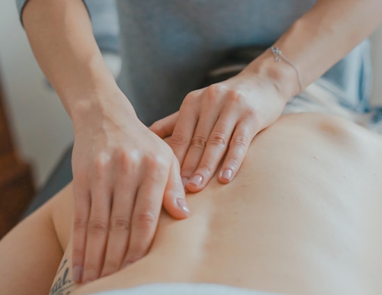 man massaging woman's body