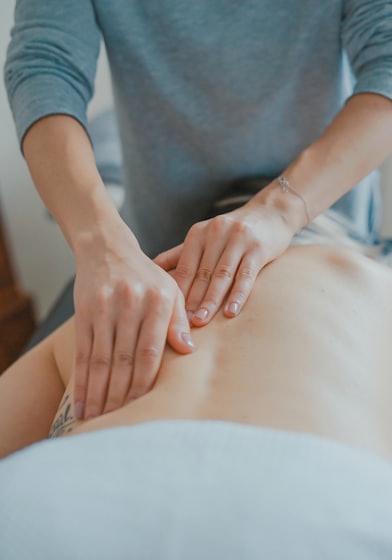 man massaging woman's body