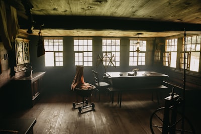 rectangular brown wooden table near chair and window farmhouse teams background