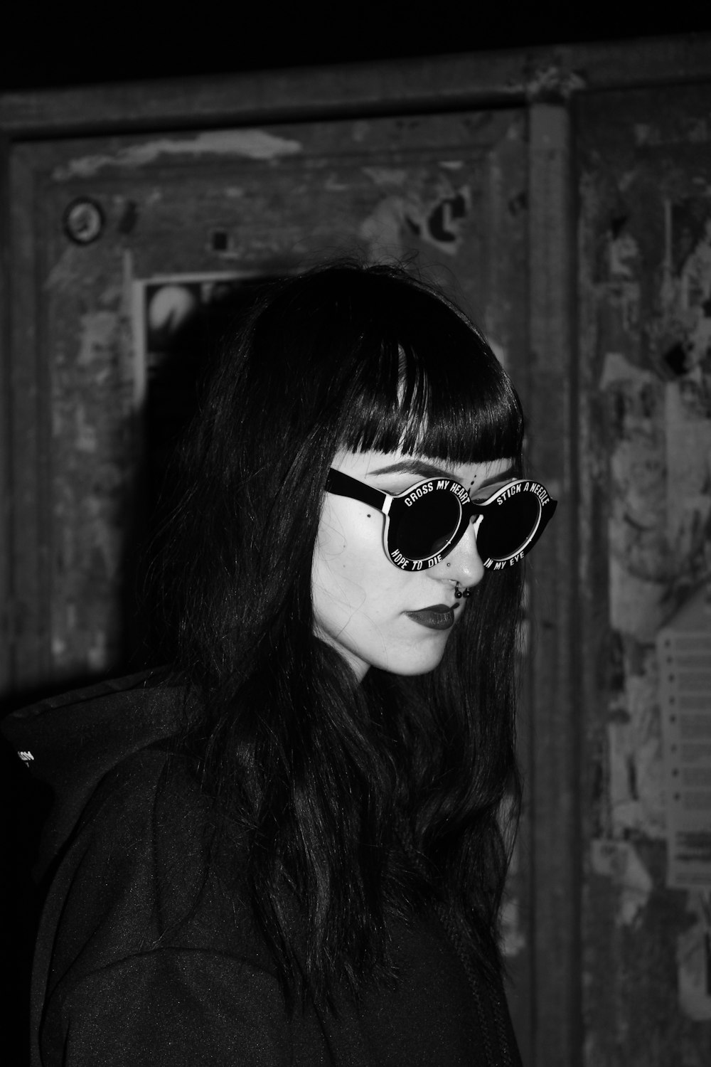 grayscale photo of woman wearing sunglasses