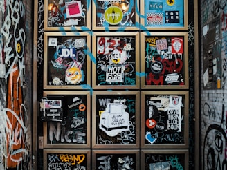 a wall covered in lots of different types of stickers