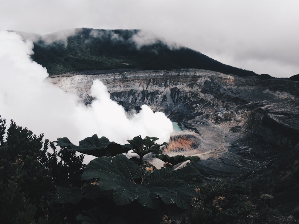 aerial photography of gray mountain with smoke