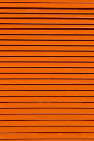 minimalist photography of orange wall