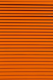 minimalist photography of orange wall