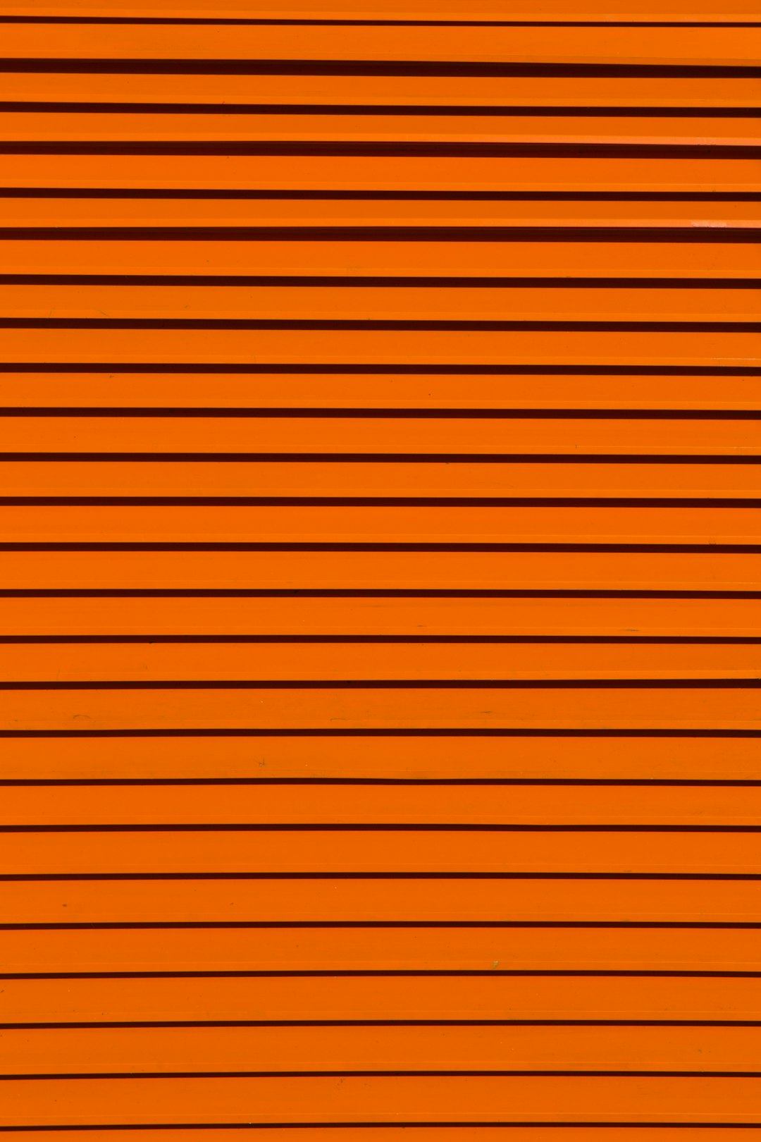 minimalist photography of orange wall