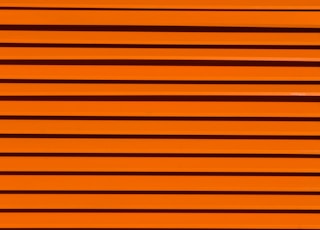 minimalist photography of orange wall