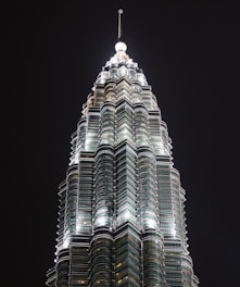 high-rise gray building at nighttime