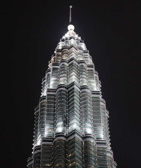 high-rise gray building at nighttime