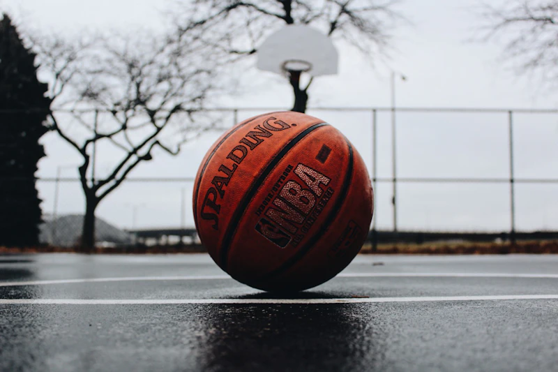 Player dunking on an outdoor backyard basketball court