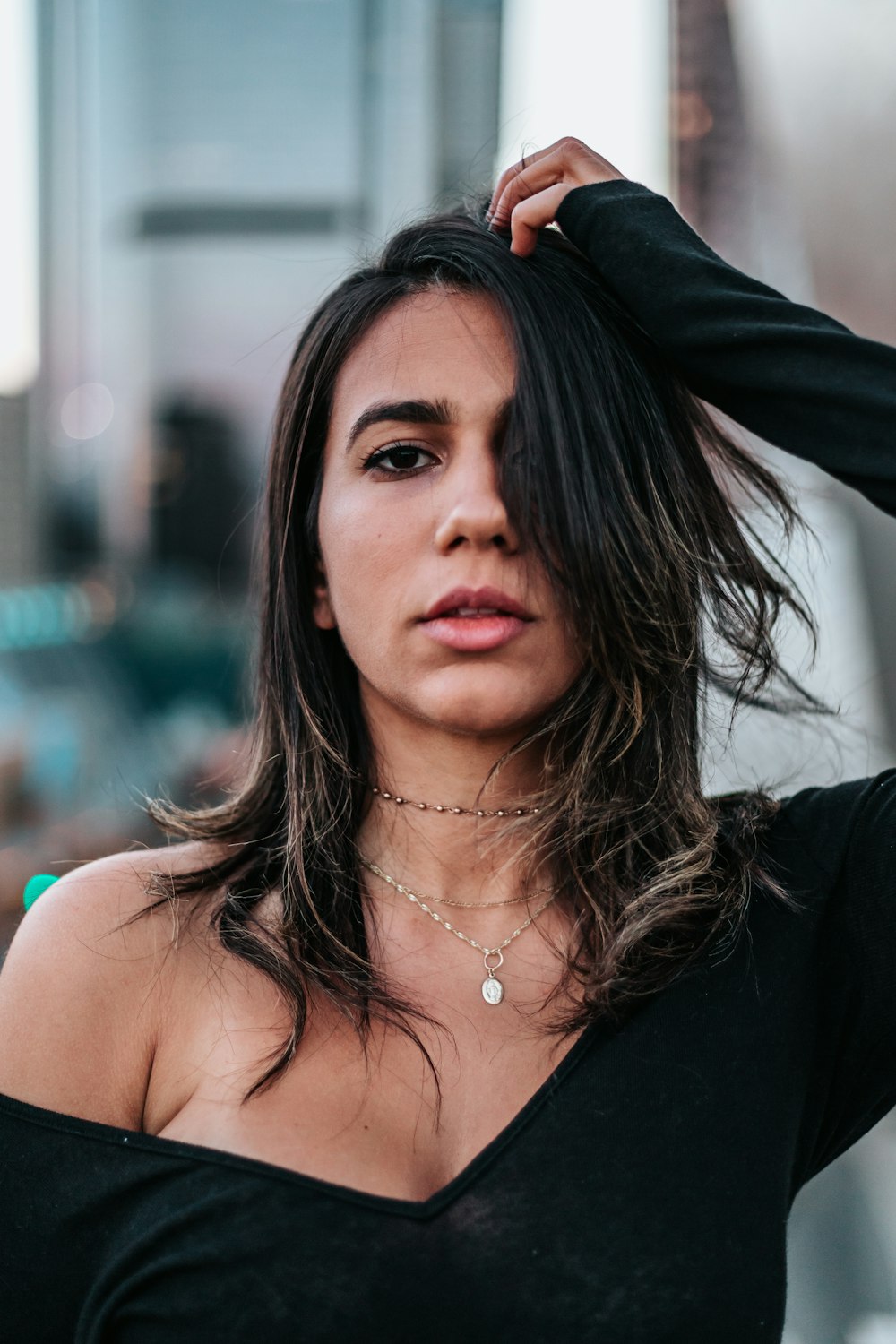 woman wearing black scoop-neck long-sleeved shirt