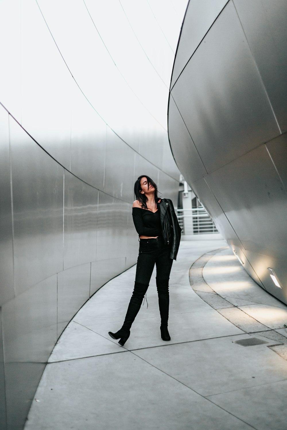 woman in black off-shoulder dress and black pants