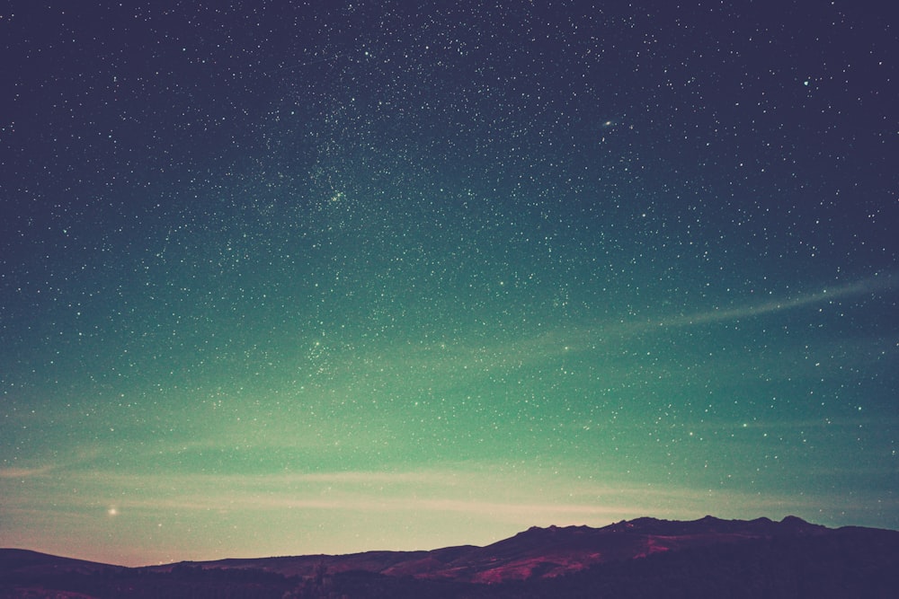 mountain under dark sky at night