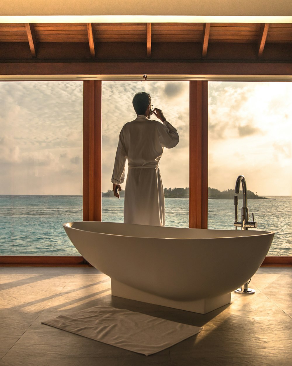 man standing beside bathtub